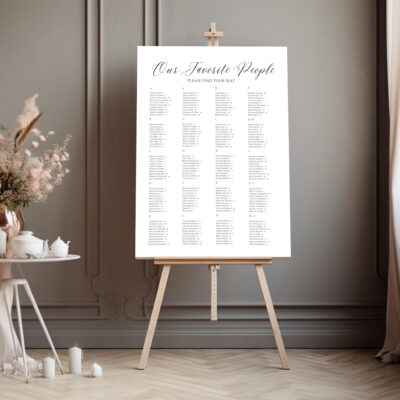 Editable Canva seating chart in Elegant Script wedding style shown in dark room