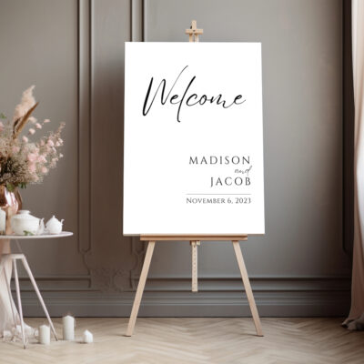 Editable Canva sign in Modern Welcome wedding style shown in a dark room