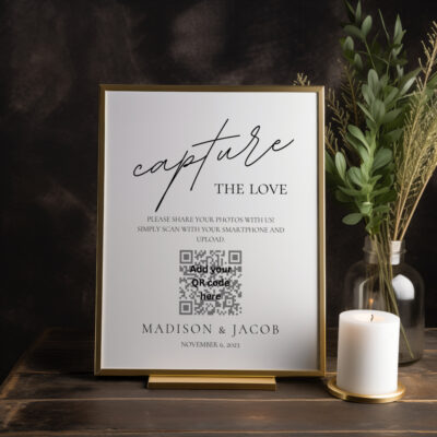 Editable Canva Capture the Love sign in Simple Script wedding style shown in dark room with candle