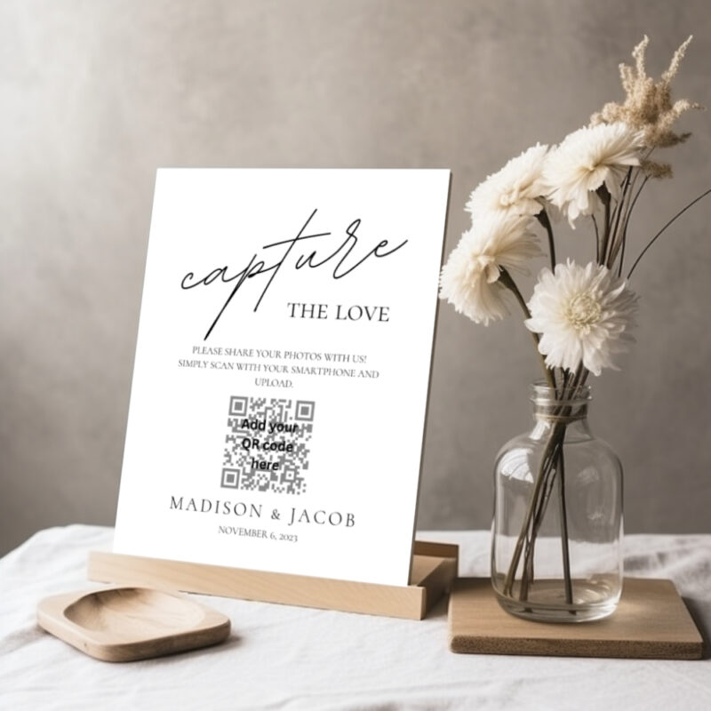 Editable Canva Capture the Love sign in Simple Script wedding style shown in tabletop display